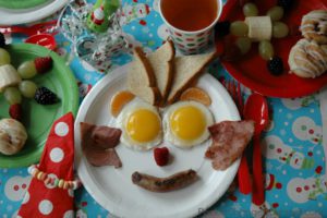 15570199-funny-christmas-breakfast-with-christmas-tree-and-snowman-made-stock-photo