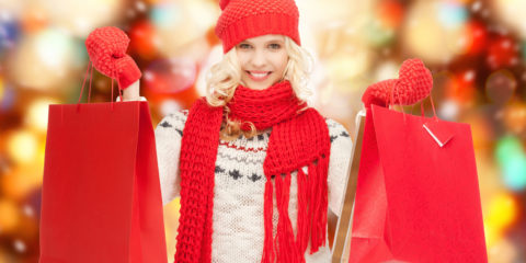 holidays, sale, shopping, christmas concept - beautiful teenage girl in winter clothes with shopping bags