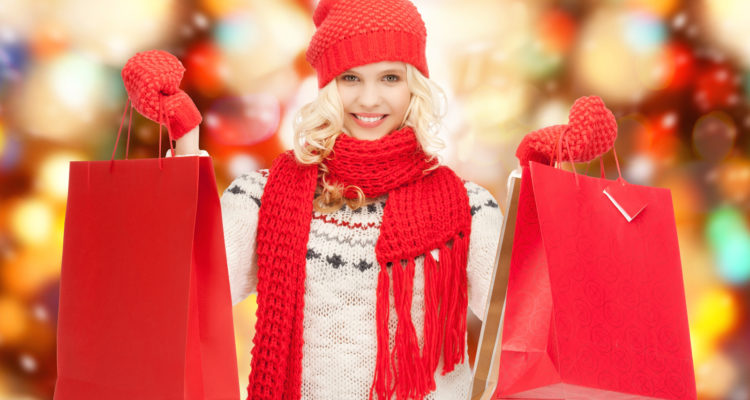 holidays, sale, shopping, christmas concept - beautiful teenage girl in winter clothes with shopping bags